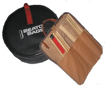Snare drum in gig bag and leather stick portfolio